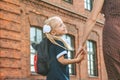 Primary school student and parent go hand in hand. A woman and a young girl with a backpack behind her back. The beginning of the. Royalty Free Stock Photo