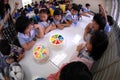 Primary school students organize birthday parties in the school canteen.