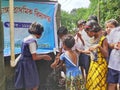 primary school students are washing their hand and their dishes before taking Mid-day meal in a primary school of West Bengal