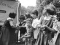 primary school students are washing their hand and their dishes before taking Mid-day meal in a primary school of West Bengal