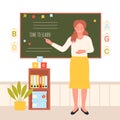 Primary school teacher standing at board in modern classroom interior, teaching students Royalty Free Stock Photo