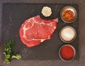 Prime rib steak on dark surface Royalty Free Stock Photo