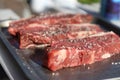 Prime steak cuts seasoned and ready for searing