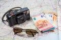 Primelin - France, January 24, 2018 : Roadmap, camera, sunglasses and euro notes