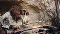 Primeval Caveman Wearing Animal Skin Trying to make a Fire with Bow Drill Method. Neanderthal Kind Royalty Free Stock Photo