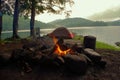 Primitive Bushcraft Campsite with a tent, chair, chair and campfire in the Adirondack Mountain Wilderness.