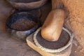 Primitive grinding stone in adobe hut Royalty Free Stock Photo