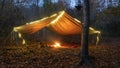 Primitive Tarp Shelter with campfire and fairy lights. Survival Bushcraft setup in the Blue Ridge Mountains near Asheville. During