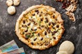 Primo Pizza topping with mushroom and coriander isolated on dark background with raw food top view of italian fastfood appetizer