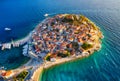 Primosten town, Croatia. View of the city from the air. Seascape with beach and old town. View from drone on the peninsula with ho