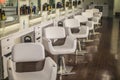 primp and blow beauty salon row of white chairs aligned the same way