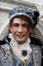 Prince Charming at the Venice Carnival. Historic building on the background. Venice, Italy