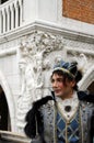 Prince Charming at the Venice Carnival. Historic building on the background. Venice, Italy
