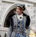 Prince Charming at the Venice Carnival. Historic building on the background. Venice, Italy