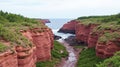 Prince Edward Island National Park Red Cliffs Sandy Beaches and Green Rolling Fields Royalty Free Stock Photo