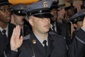 A plice graduate gets sworn in during a police graduation ceremony Royalty Free Stock Photo