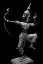 Prince Rama statue with a bow. Archer, Rama of Hinduism sculpture isolated on black background