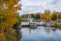 Princes Island Park Jaipur Bridge at Bow river bank. Autumn foliage scenery in downtown Calgary