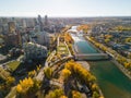 Princes Island Park Peace Bridge autumn foliage scenery. Aerial view of Downtown City of Calgary