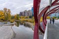 Princes Island Park Peace bridge. Autumn foliage scenery in downtown Calgary Bow river bank Royalty Free Stock Photo