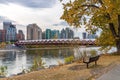 Princes Island Park Peace bridge. Autumn foliage scenery in downtown Calgary Bow river bank Royalty Free Stock Photo