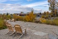 Princes Island Park Peace bridge. Autumn foliage scenery in downtown Calgary Bow river bank Royalty Free Stock Photo