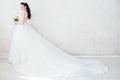 Princess Bride in a wedding dress standing in a room of vintage Royalty Free Stock Photo