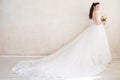 Princess Bride in a wedding dress standing in a room of vintage Royalty Free Stock Photo