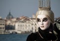 Princess with crown, blondy hair and venetian mask during venice carnival Royalty Free Stock Photo