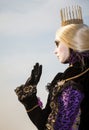 Princess with crown, blondy hair and venetian mask during venice carnival Royalty Free Stock Photo