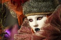 Princess with crown, blondy hair and venetian mask during venice carnival Royalty Free Stock Photo