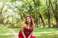 Princess with crown in cloudy red dress