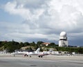 Private jets and traffic control tower in Princess Juliana Airport , St. Maarten