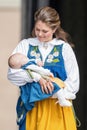 Princess Madeleine of Sweden with Princess Leonore in her arms a