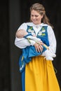 Princess Madeleine of Sweden with Princess Leonore in her arms a