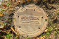 PRINCETON, NJ USA - NOVENBER 12, 2019: Cast-iron sewer manhole near a road in Princeton, New Jersey