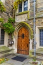 PRINCETON, USA - NOVENBER 12, 2019: a view of Foulke Hall at Princeton University. Wooden door and elements of architecture, Royalty Free Stock Photo
