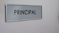 Principal office door, hand knocking, chief executive officer, school director