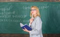 Principles can make teaching effective. Woman teaching near chalkboard in classroom. Effective teaching involve