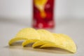 Pringles Chips Tube and Chips in Front on Gray Background Royalty Free Stock Photo