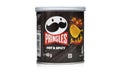 Pringles hot and spicy small black cylinder container package isolated on white background