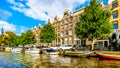 The Prinsengracht Prince Canal with it many historic houses and pleasure boats in the center of Amsterdam Royalty Free Stock Photo