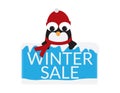 Cute Penguin with Red Beanie and scarf behind a Blue sign with snow and WINTER SALE text Royalty Free Stock Photo