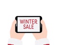 Hands holding tablet with WINTER SALE text on White background