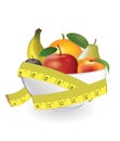 Fruits in bowl with measuring tape Royalty Free Stock Photo