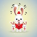 Cute rabbits singing Merry Christmas