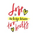Love is bridge between two hearts - motivational quote. Hand drawn beautiful lettering. Royalty Free Stock Photo