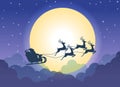 Santa Claus flying on a sleigh with reindeers over cloud and full moon background Royalty Free Stock Photo