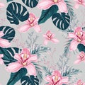 Seamless pattern with flowers Orchid, colorful tropical leaves and herbs. Royalty Free Stock Photo