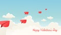 Heart shaped paper airplanes flying over fluffy clouds.